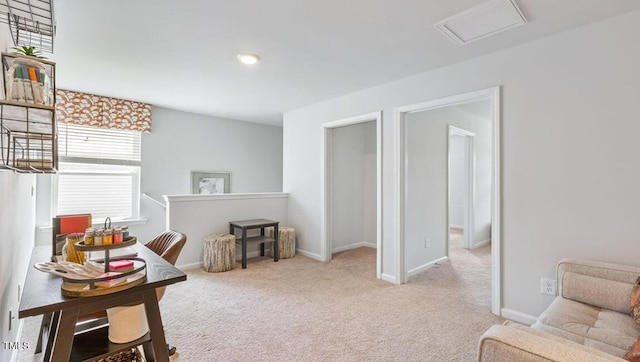 sitting room with light colored carpet