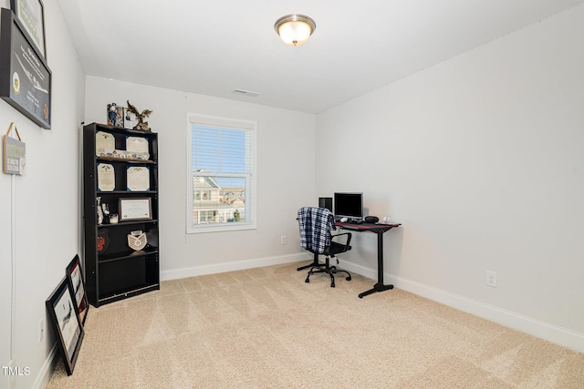 office area featuring light colored carpet