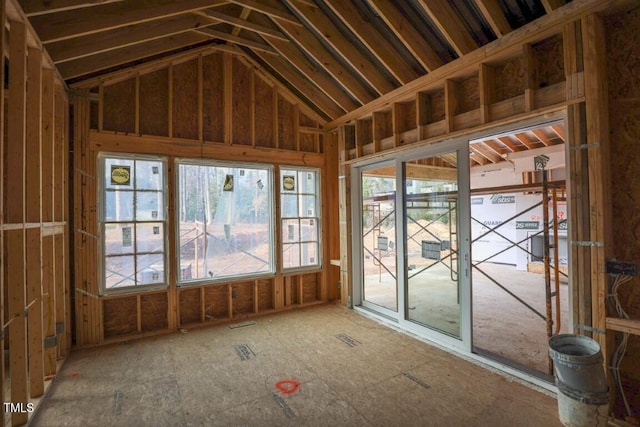 unfurnished sunroom with lofted ceiling