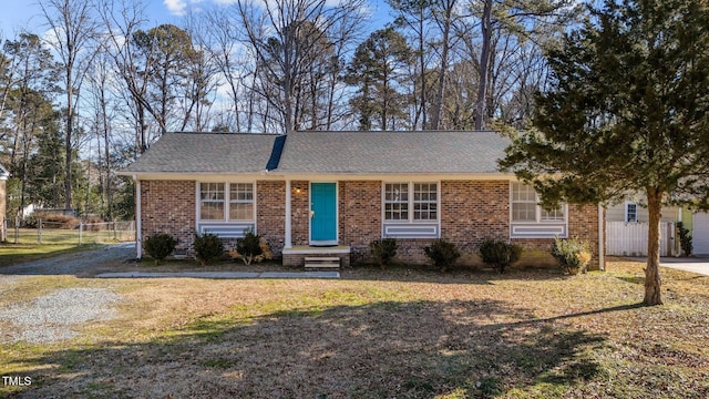 ranch-style house featuring a front lawn