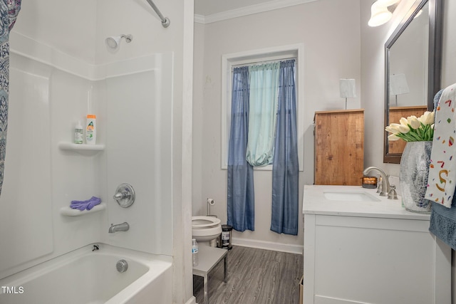 full bathroom with toilet, vanity, ornamental molding, hardwood / wood-style flooring, and shower / tub combination