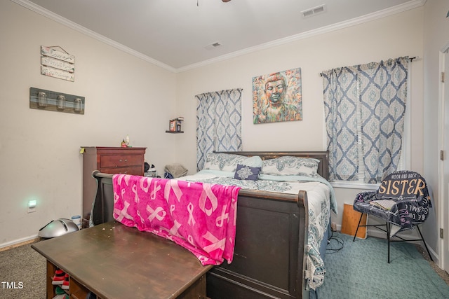 bedroom featuring ornamental molding and carpet