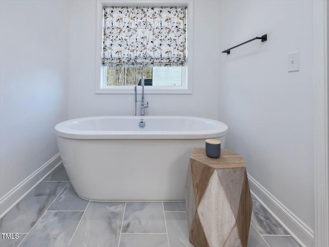 bathroom featuring a washtub