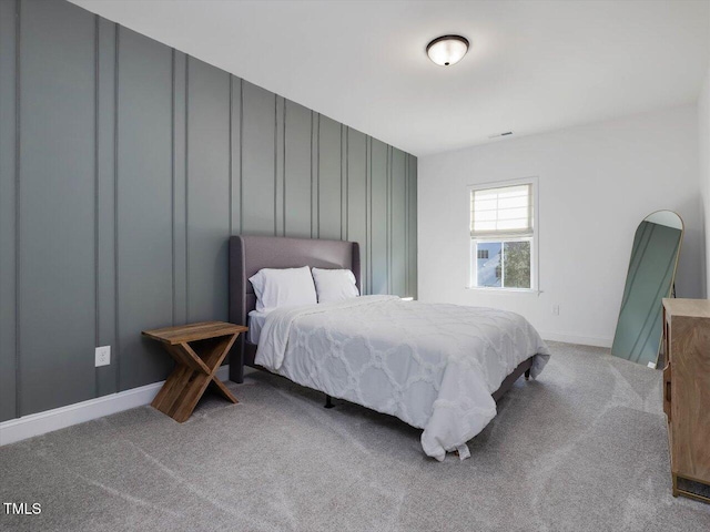 bedroom featuring light carpet