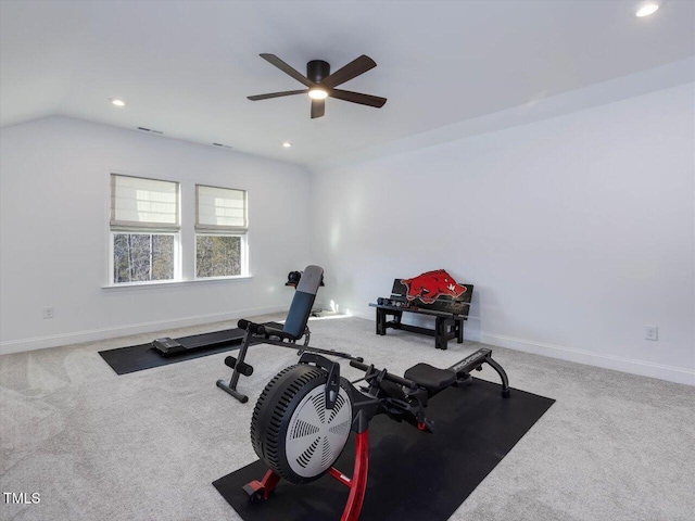 workout room with ceiling fan, carpet floors, and lofted ceiling