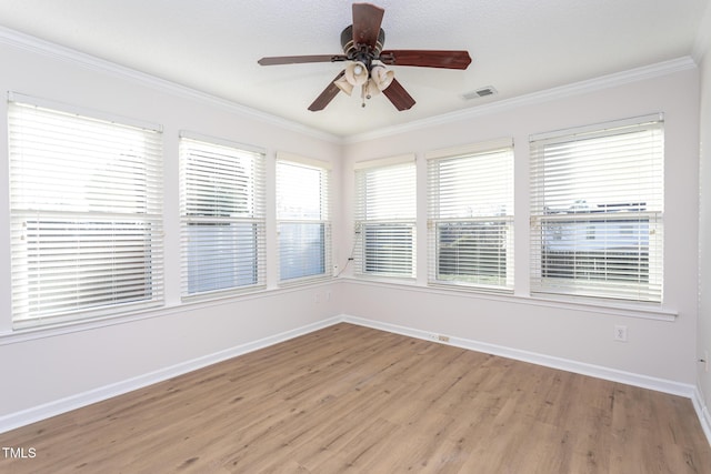 unfurnished room with ceiling fan, ornamental molding, and light hardwood / wood-style floors