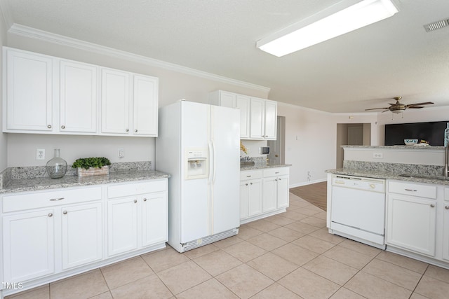 kitchen featuring light stone countertops, white appliances, white cabinetry, light tile patterned flooring, and ceiling fan