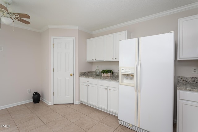 kitchen featuring white cabinetry, light stone countertops, white refrigerator with ice dispenser, ornamental molding, and light tile patterned floors