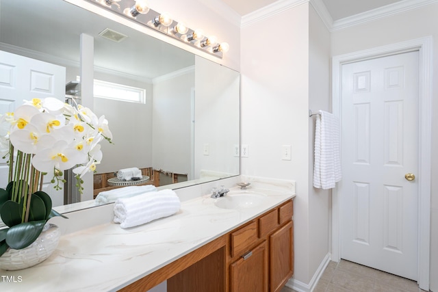 bathroom featuring vanity, tile patterned flooring, and ornamental molding