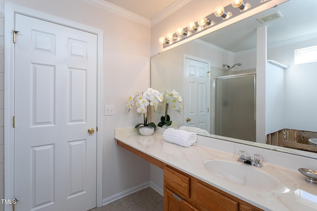 bathroom with tile patterned flooring, walk in shower, ornamental molding, and vanity