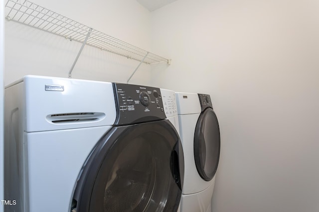 laundry room with washer and clothes dryer