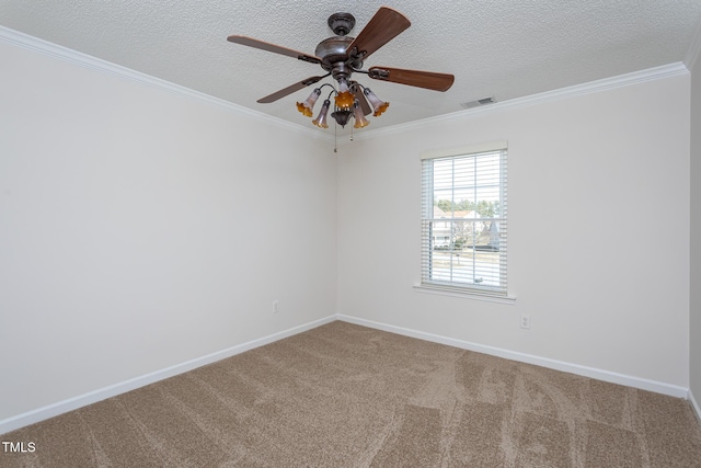 carpeted spare room featuring ceiling fan, ornamental molding, and a textured ceiling