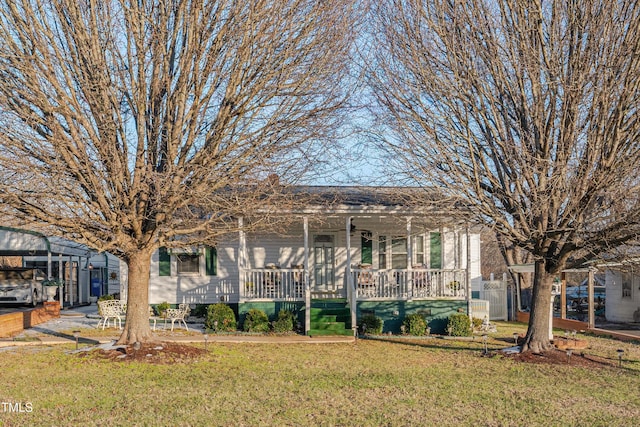 view of front of house with a front yard and a porch