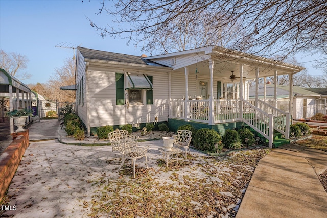 exterior space with covered porch and ceiling fan