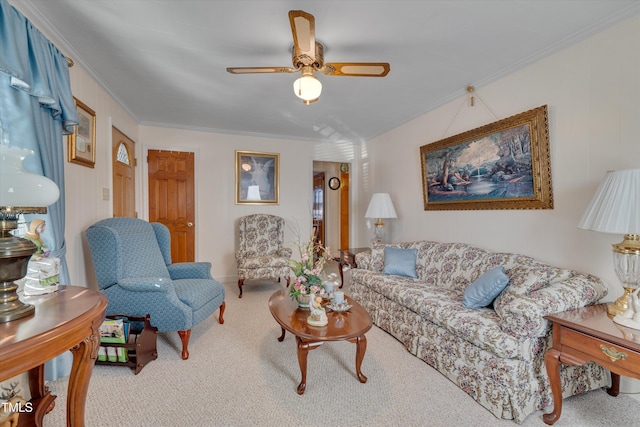 carpeted living room with ceiling fan and crown molding