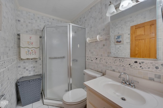 bathroom with toilet, crown molding, vanity, tile walls, and a shower with shower door