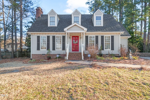 new england style home with a front lawn