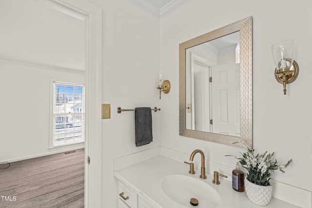 bathroom featuring ornamental molding and vanity