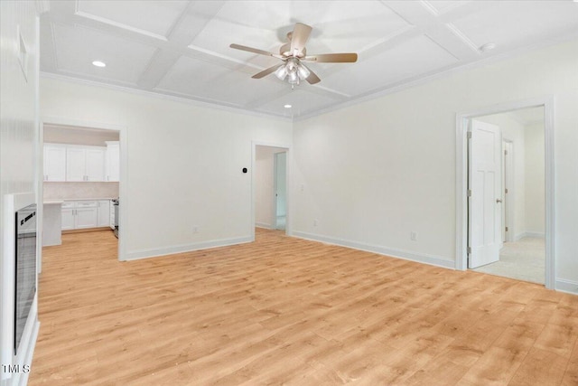 empty room with light hardwood / wood-style floors, beam ceiling, ceiling fan, ornamental molding, and coffered ceiling