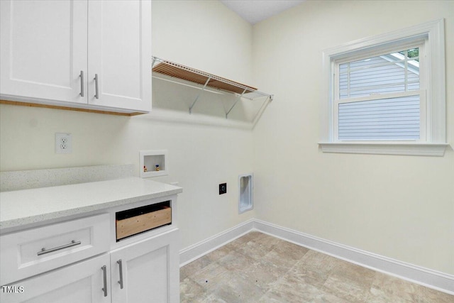 laundry area with electric dryer hookup, washer hookup, and cabinets