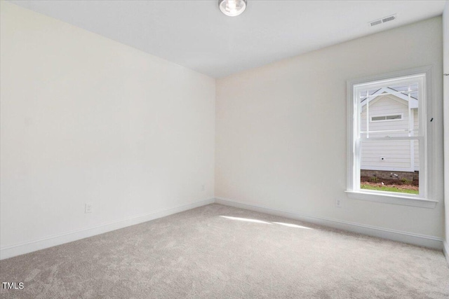 spare room featuring carpet floors