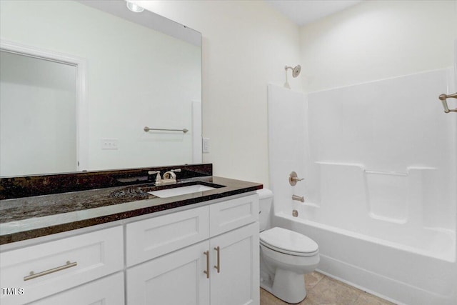 full bathroom featuring bathing tub / shower combination, vanity, tile patterned floors, and toilet