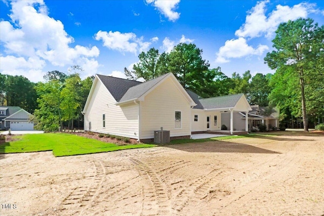 exterior space with a lawn and cooling unit