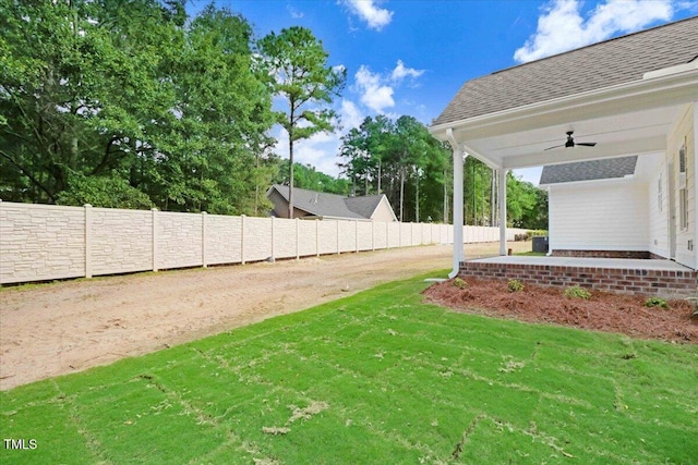 view of yard featuring ceiling fan