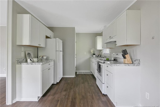 kitchen with dark hardwood / wood-style flooring, sink, white appliances, and white cabinetry