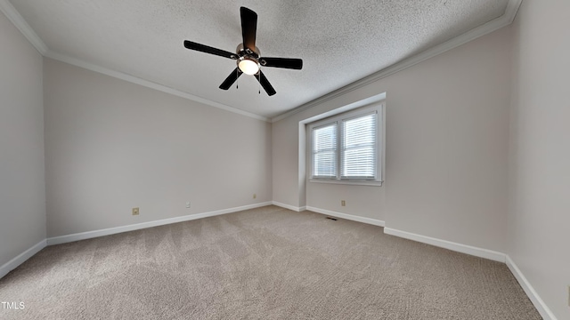 empty room featuring a textured ceiling, light carpet, and ceiling fan