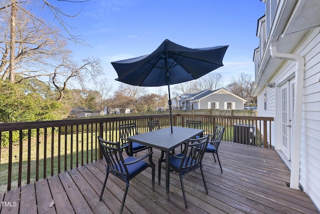 wooden terrace with a yard