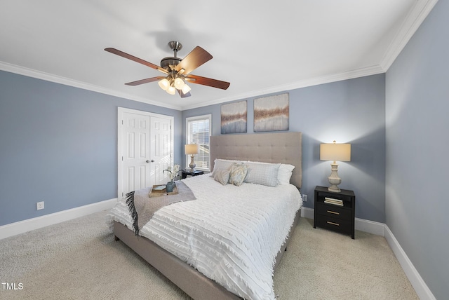 carpeted bedroom featuring ceiling fan, a closet, and ornamental molding