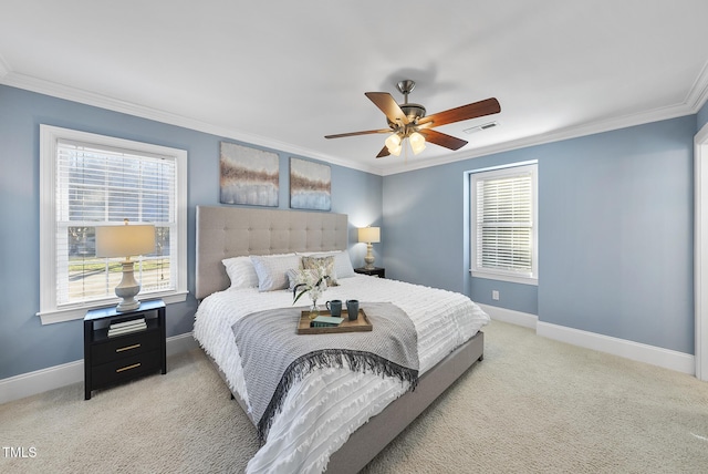 bedroom featuring ceiling fan, ornamental molding, and light colored carpet