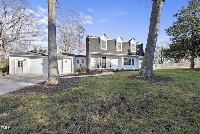 cape cod house with a garage and a front yard