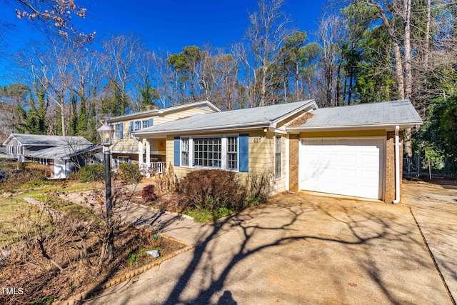 view of front of property featuring a porch and a garage