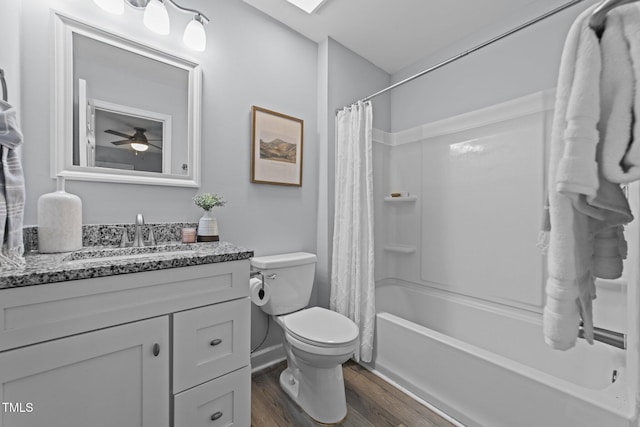 full bathroom with hardwood / wood-style floors, toilet, vanity, ceiling fan, and shower / bath combo