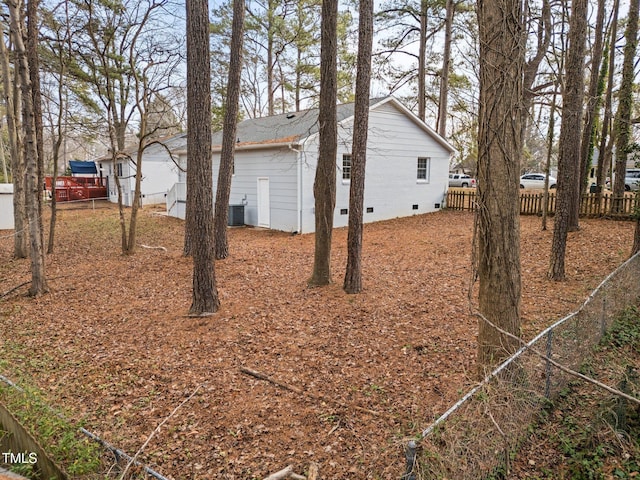 view of side of home with cooling unit