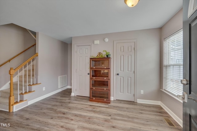 unfurnished room featuring light hardwood / wood-style flooring