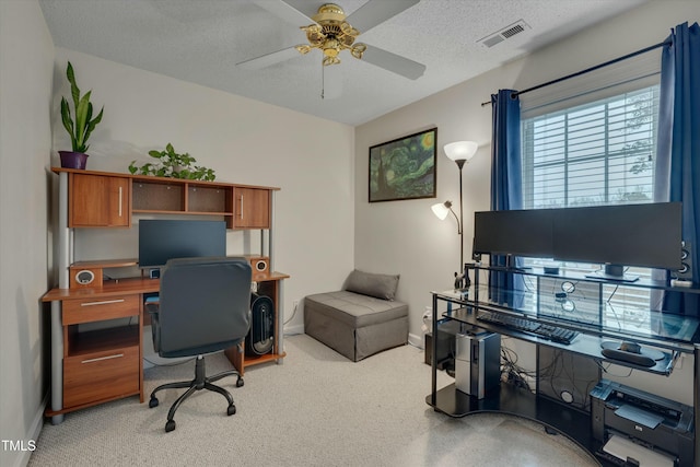 office space with ceiling fan and a textured ceiling