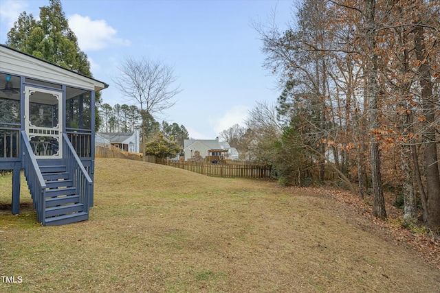 view of yard with a sunroom