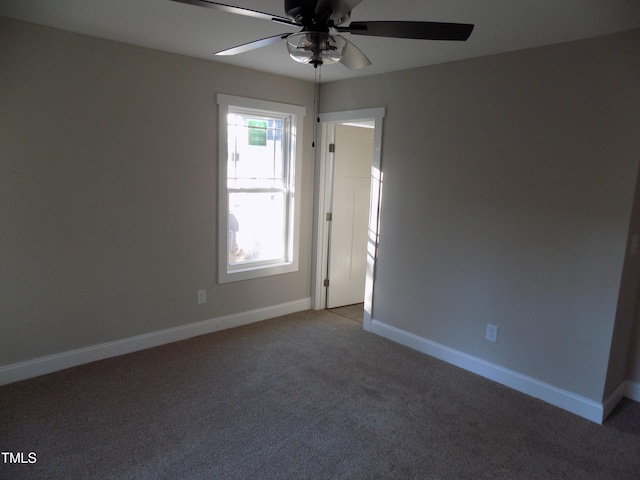 unfurnished room featuring ceiling fan and carpet flooring