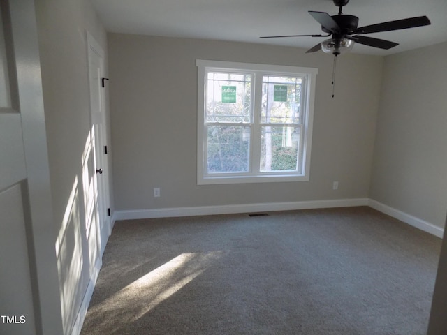 spare room with ceiling fan and carpet flooring