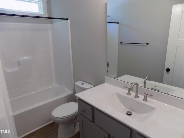 104 Halifax Rd, Louisburg, NC 27549 - bathroom with toilet, vanity, wood finished floors, and shower / bathing tub combination