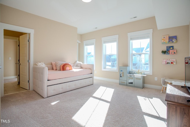 bedroom with light carpet