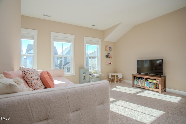 living room featuring lofted ceiling and light colored carpet