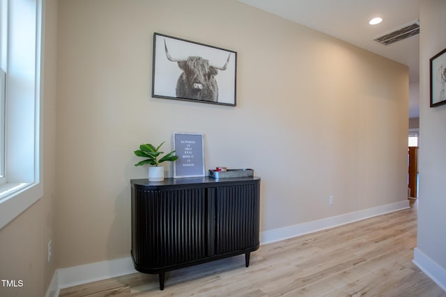 office area with light hardwood / wood-style floors