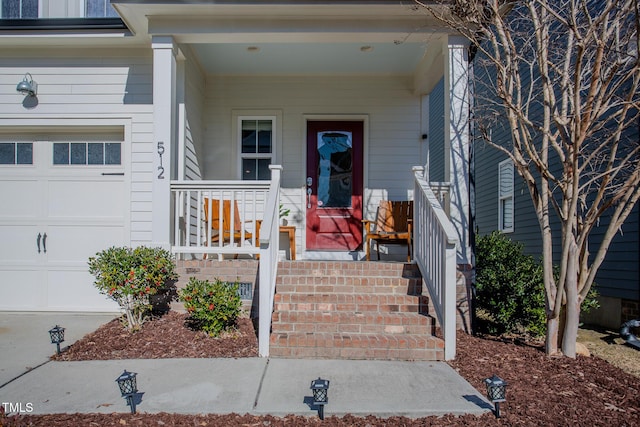 view of front of house with a porch and a garage