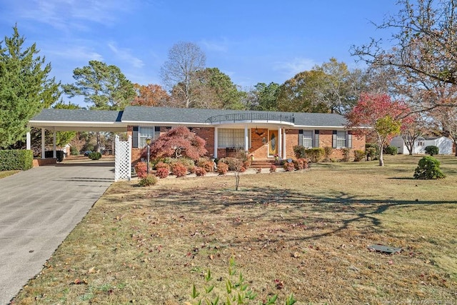 ranch-style house with a front yard and a carport