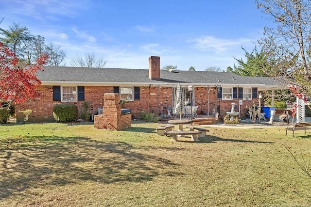 back of house with a lawn