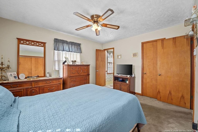 bedroom with ceiling fan, light colored carpet, and a textured ceiling